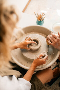 Pottery Workshop in a Creative Studio With Hands Shaping Clay