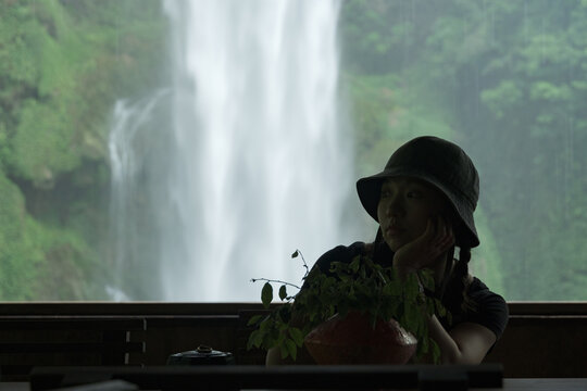 Close-up Person Waterfall Background