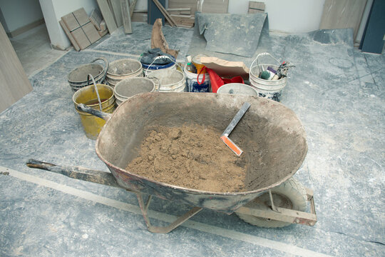 Construction tools and materials in an unfinished workspace