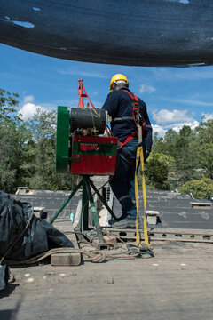 Worker Operating Machinery on a Construction Site in Daylight