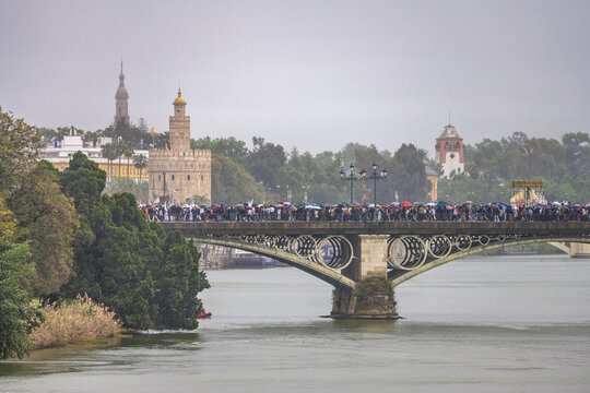 Seville Holy Week Rain: Virgen de la Salud Crosses Triana Bridge