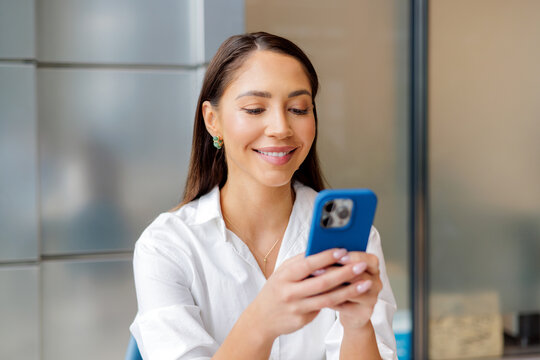 Professional Woman Checking Phone at Work