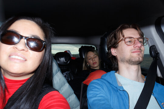Selfie of Group of Friends Road Tripping Through Scenic Landscape