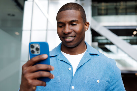 Professional Smiling Man with Smartphone Screen