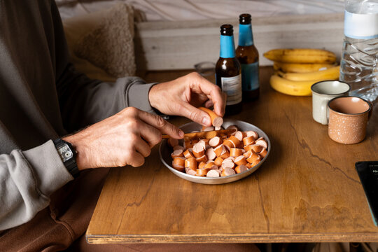 Hands preparing meal in camper