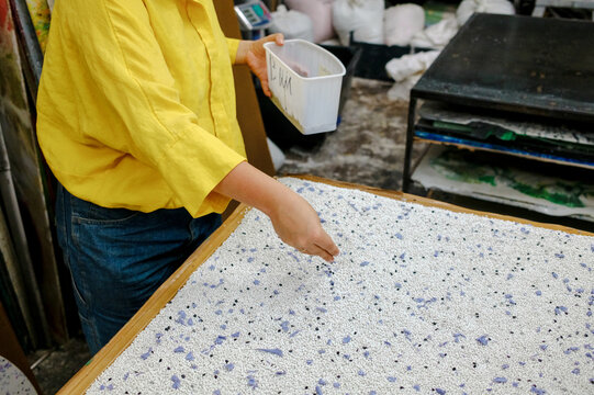 woman working with plastic in a factory