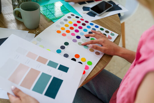 Fashion designer choosing color samples for new clothing collection