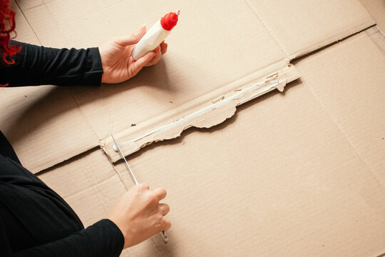 Crafting project using glue and cardboard at home