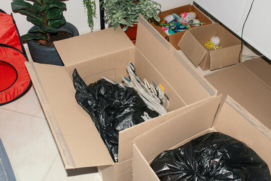 Packing boxes with various items in a domestic setting