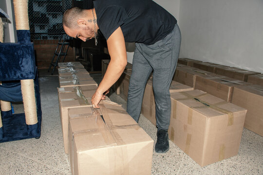 Unpacking boxes in a room during the day