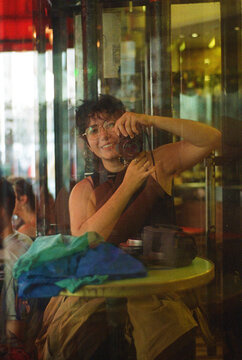Self portrait in the reflection of a bar's window