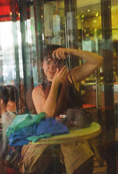 Self portrait in the reflection of a bar's window