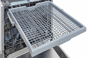 Open Dishwasher Interior Isolated White. Close-up