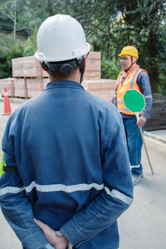 Construction workers discussing safety measures at a site