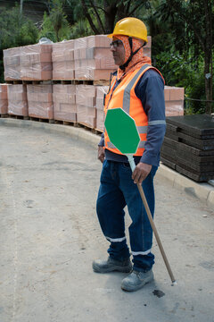 Construction worker managing site safety in urban environment