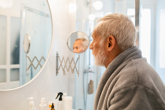 Bathroom Reflecting Senior Citizen Man