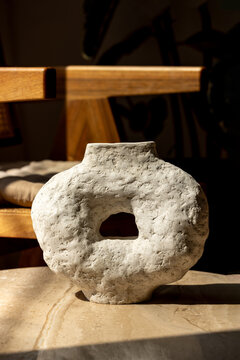 Rustic Handrcrafted Vase with Circular Design in Natural Sunlight