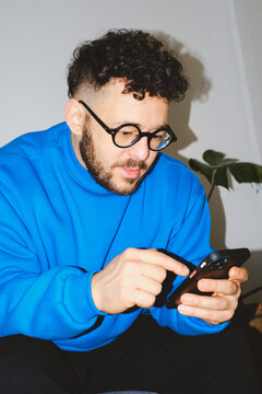 Man Using Smartphone Indoors