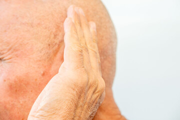Close-up elderly man's ear, showing details aged skin, wrinkles, and potential presence hearing aid, health, aging process, and audiology concept, hearing loss awareness, Potential use hearing aids