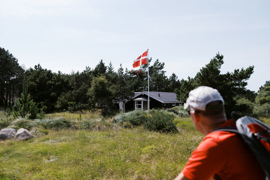 man biking in coastal Denmark on vacation in summer