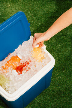 Colorful Drinks in Cooler Filled With Ice