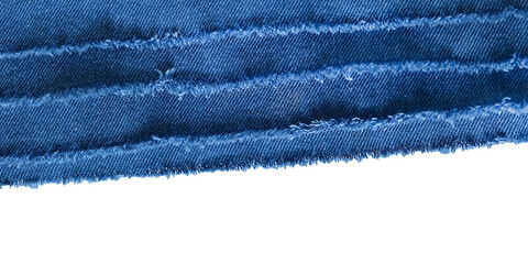 Blue denim fabric texture close up. Frayed jeans seam with visible stitching. Fashion textile...