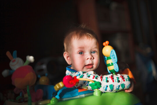 Baby Exploring Colors and Toys in Warm Sunlight