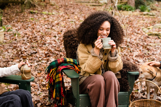 Happy Woman at Fall Campfire