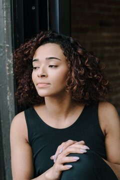 Minimal Portait of Woman Sitting on Stoop 