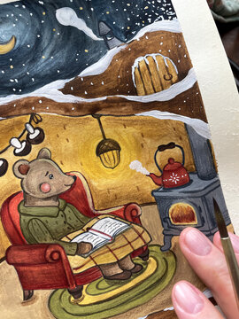 Contemplating an illustration of a bear in winter