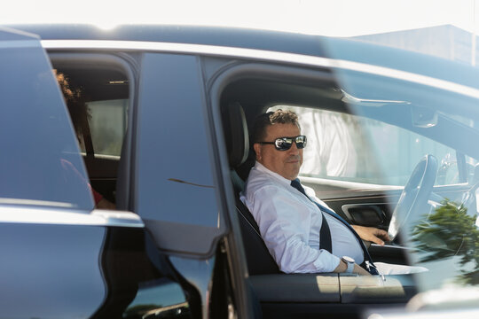 Businessman in Luxury Car 