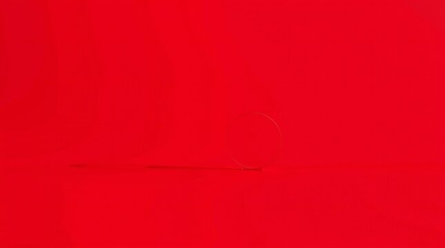 Vibrant solid red background with subtle texture and light variations