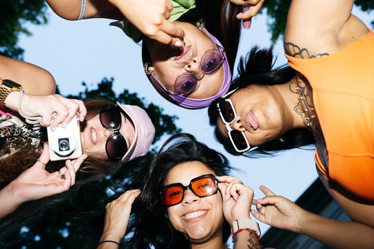 Friends Taking Fun Photos Outdoors