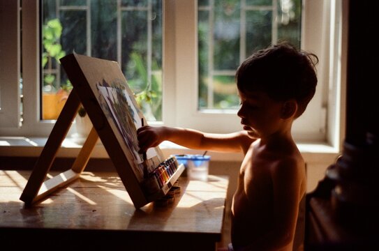 Todder Draws While Sitting At The Table