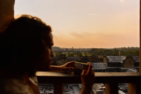Man taking photo of sunset Siem Reap