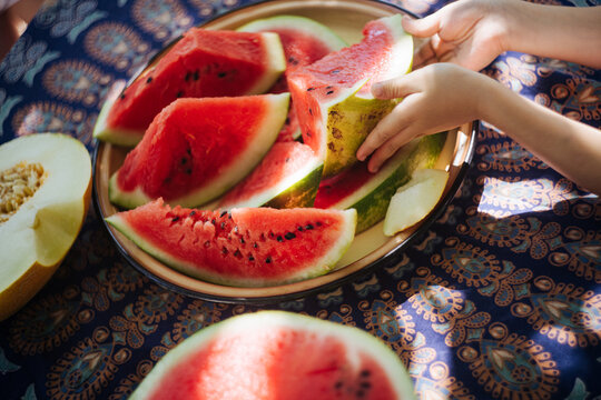 Juicy watermelon cut with sharp knife