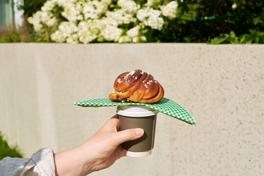 Delicious pastries and coffee in a sunny park
