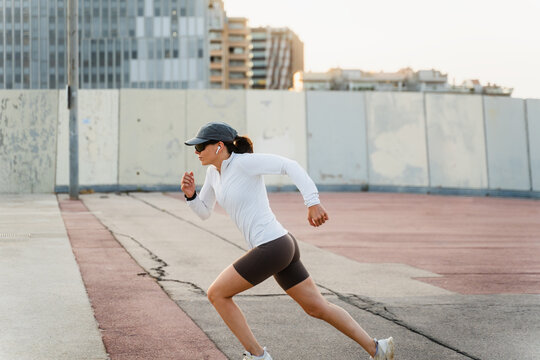 Athlete woman sprints outdoors