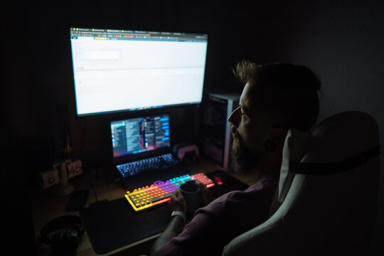 Bearded  man working at night
