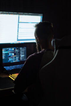 Young man focused on night work