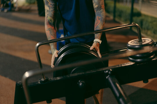 Heavy gym equipment on outdoor gym under night lights