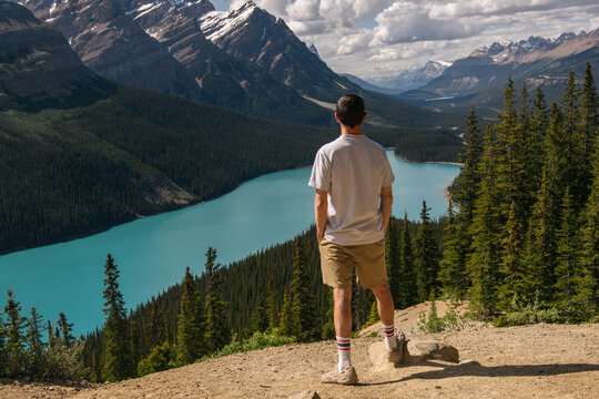 Young man exploring wild beauty of Canadian Rocky Mountains