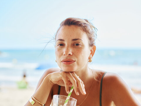 Relaxing by the Beach While Enjoying a Refreshing Drink