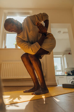 Chair Pose Yoga Instructor at home