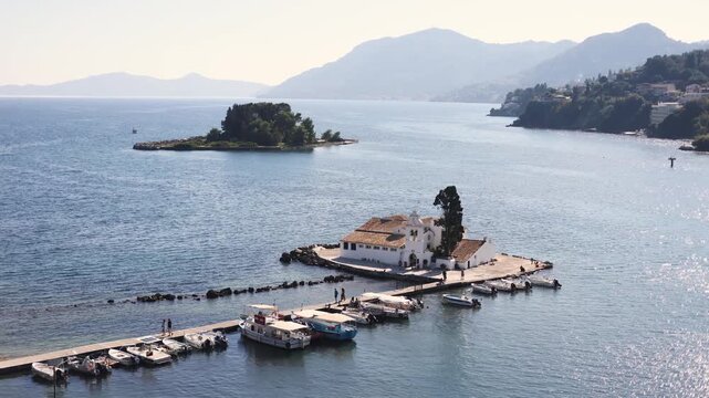 Holy Monastery of Panagia Vlacherna, Kanoni, Corfu Island, Kerkyra, Greece, with Ionian sea and Pontikonissi island, beautiful summer sunny day