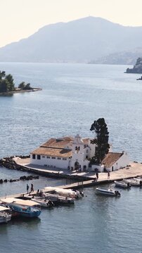 Holy Monastery of Panagia Vlacherna, Kanoni, Corfu Island, Kerkyra, Greece, with Ionian sea and Pontikonissi island, beautiful summer sunny day