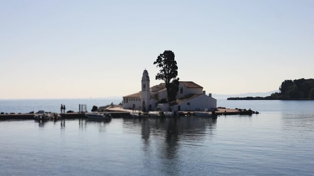 Holy Monastery of Panagia Vlacherna, Kanoni, Corfu Island, Kerkyra, Greece, with Ionian sea and Pontikonissi island, beautiful summer sunny day