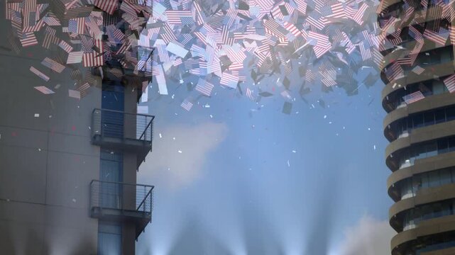 Lights beaming, haze rising, starting US-flag confetti drifting down across sky, adding flag flair
