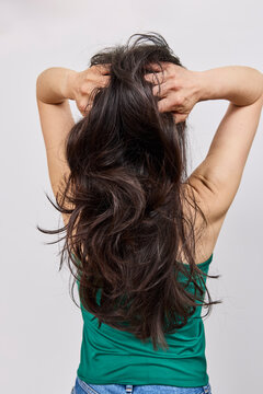 Asian woman with long dark hair in studio