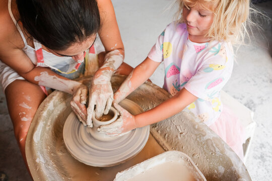 Creative Pottery Session Between an Adult and a Child in a Studio